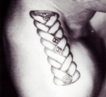 Zek's shoulder-chest eaulette tattoo